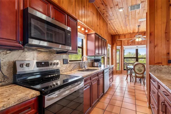 a balcony with chairs and a table