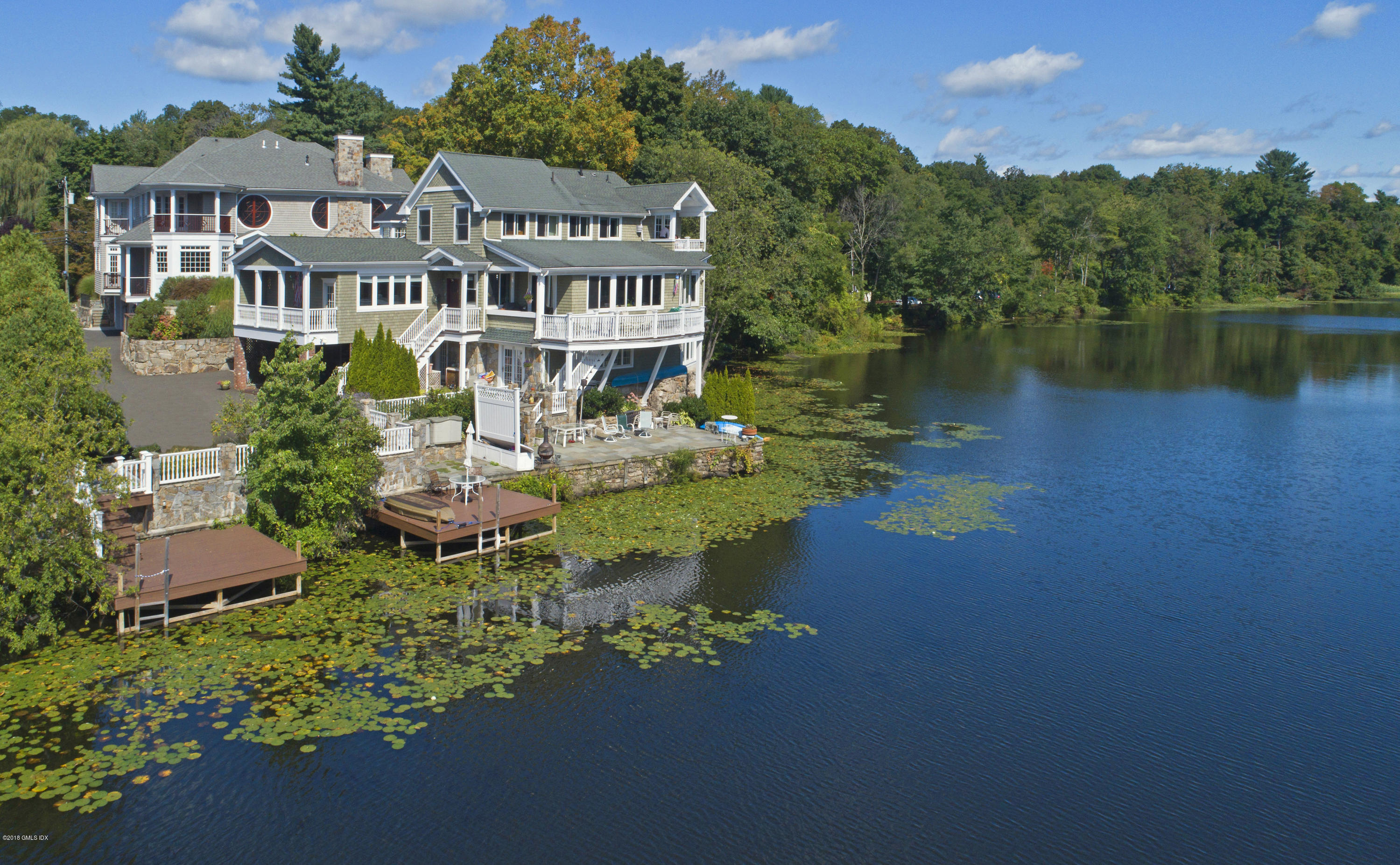 99 Valley Road, Unit E Cos Cob, CT 06807 - Photo 1 of 28 an aerial view of a house with pool table and chairs