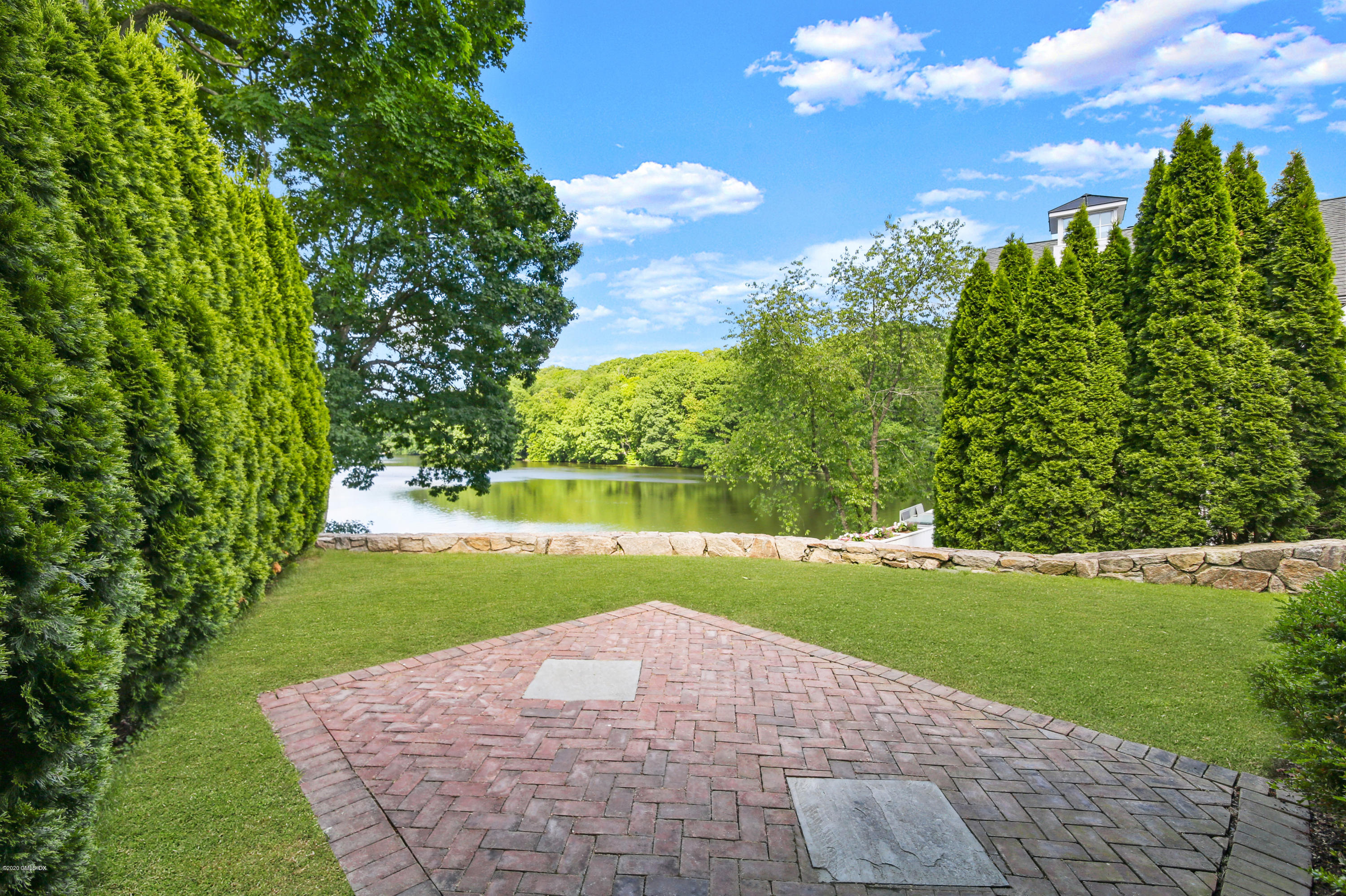 99 Valley Road, Unit E Cos Cob, CT 06807 - Photo 16 of 28 a view of a golf course with a garden