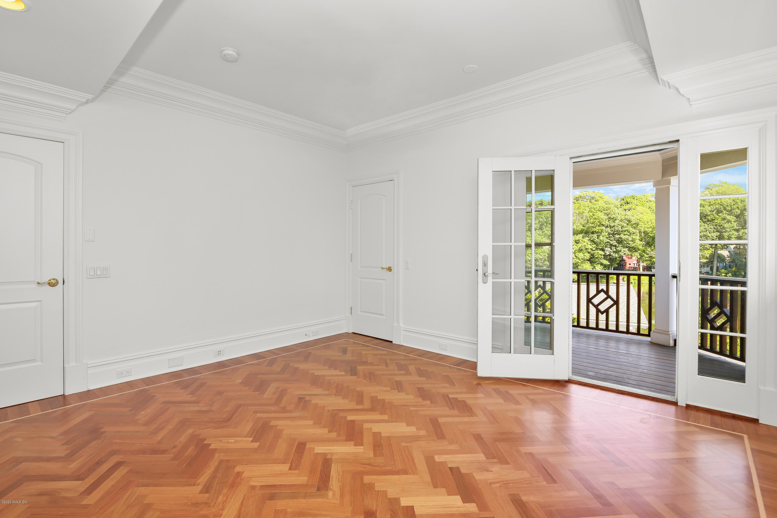 99 Valley Road, Unit E Cos Cob, CT 06807 - Photo 21 of 28 a view of an empty room with wooden floor and a window