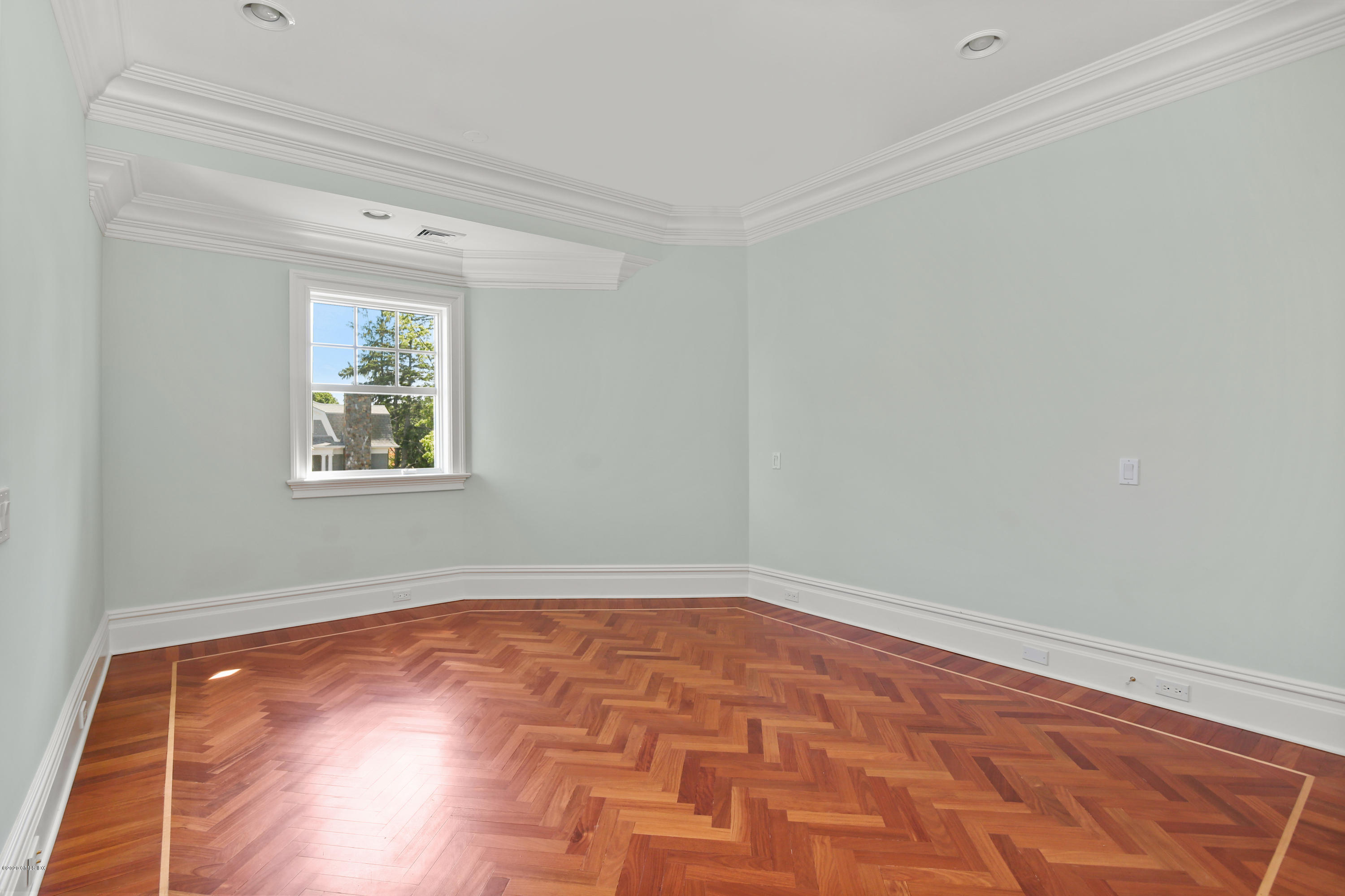 99 Valley Road, Unit E Cos Cob, CT 06807 - Photo 22 of 28 a view of room with window and wooden floor