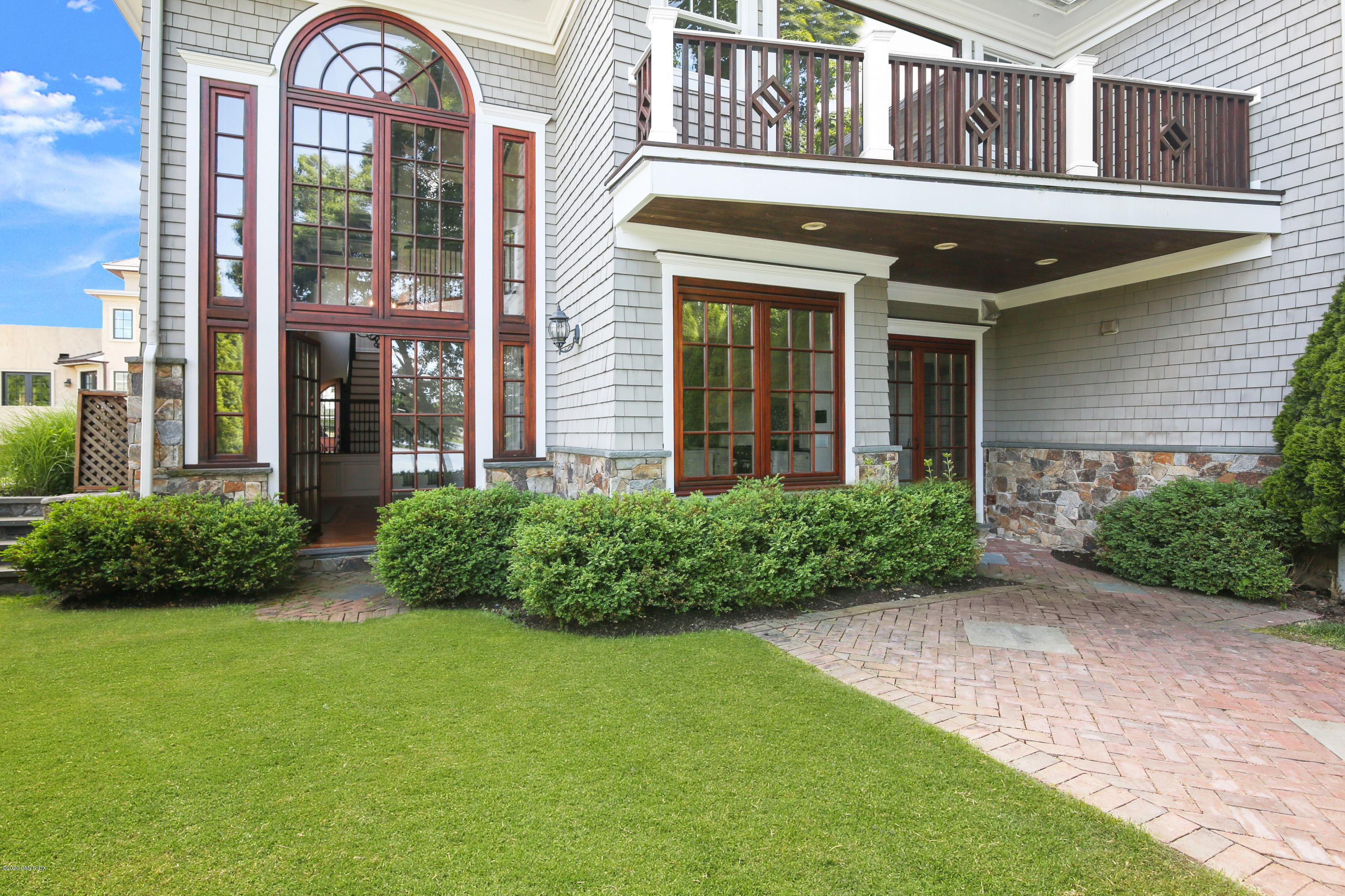 99 Valley Road, Unit E Cos Cob, CT 06807 - Photo 24 of 28 a view of a brick building with a large windows