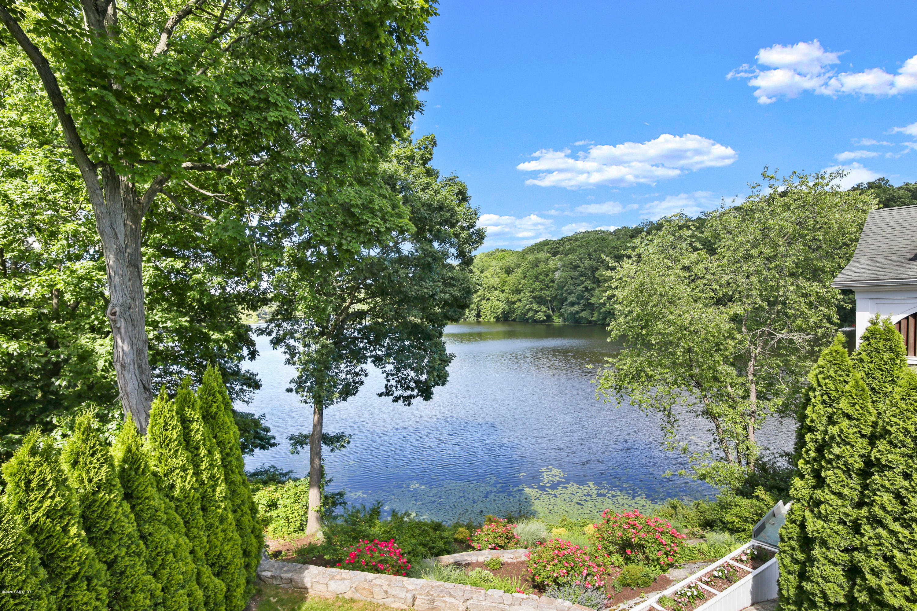 99 Valley Road, Unit E Cos Cob, CT 06807 - Photo 3 of 28 a view of a garden with a tree
