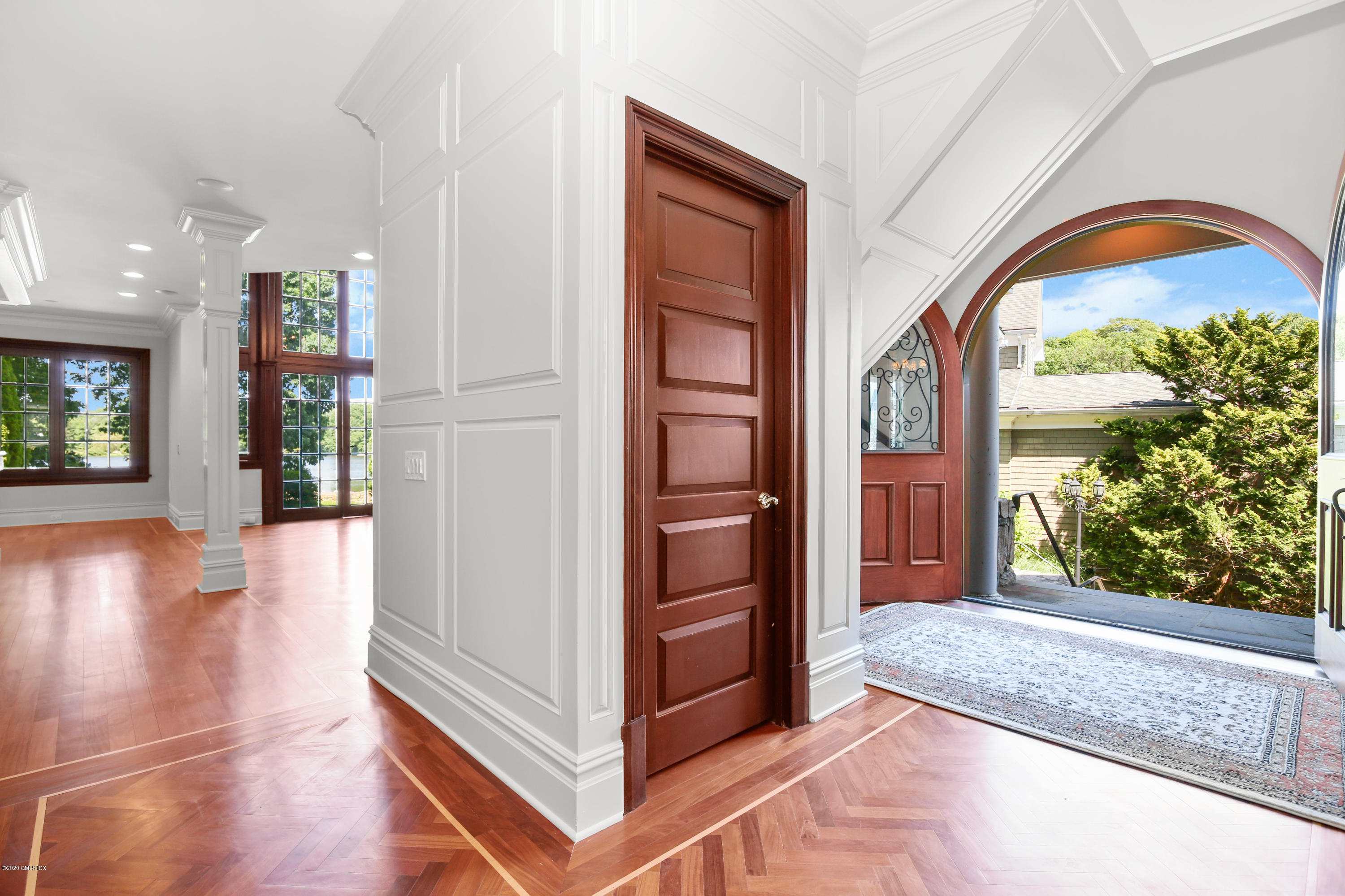 99 Valley Road, Unit E Cos Cob, CT 06807 - Photo 4 of 28 a view of an entryway with wooden floor and a living room