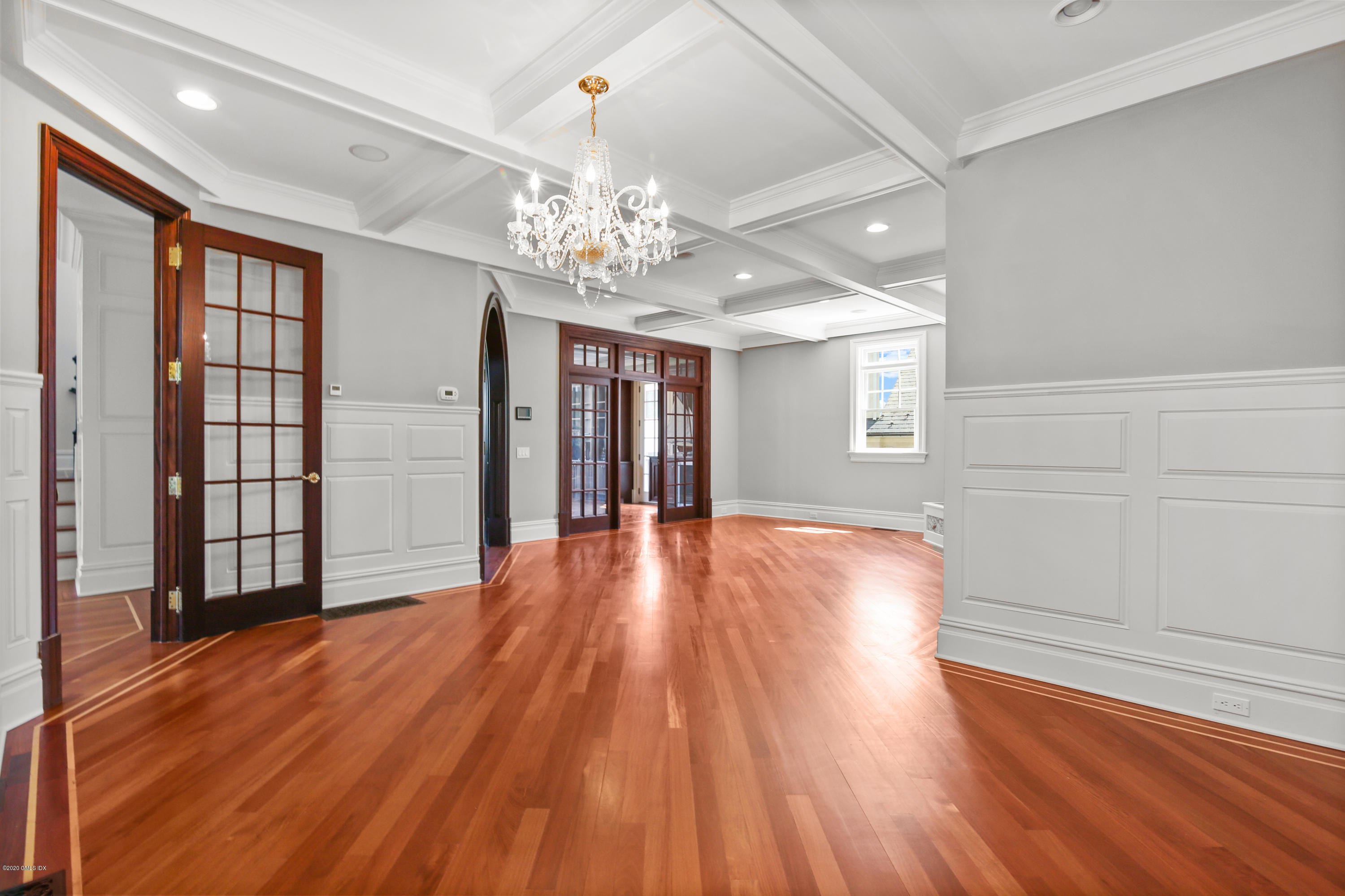 99 Valley Road, Unit E Cos Cob, CT 06807 - Photo 10 of 28 a view of an empty room with wooden floor and a window