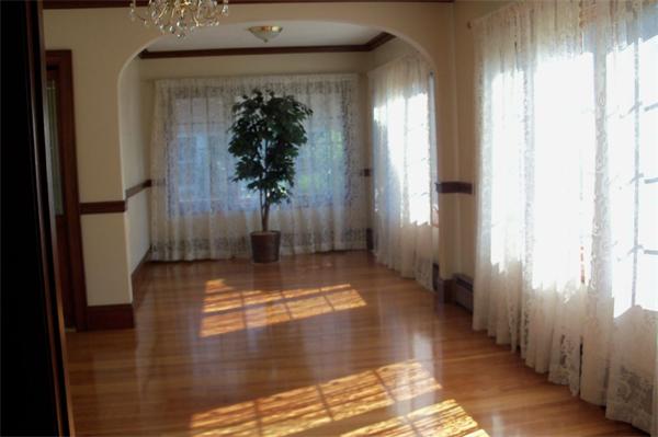 33 Chesterfield Road Newton, MA 02465 - Photo 7 of 10 a view of a hallway with wooden floor and a living room