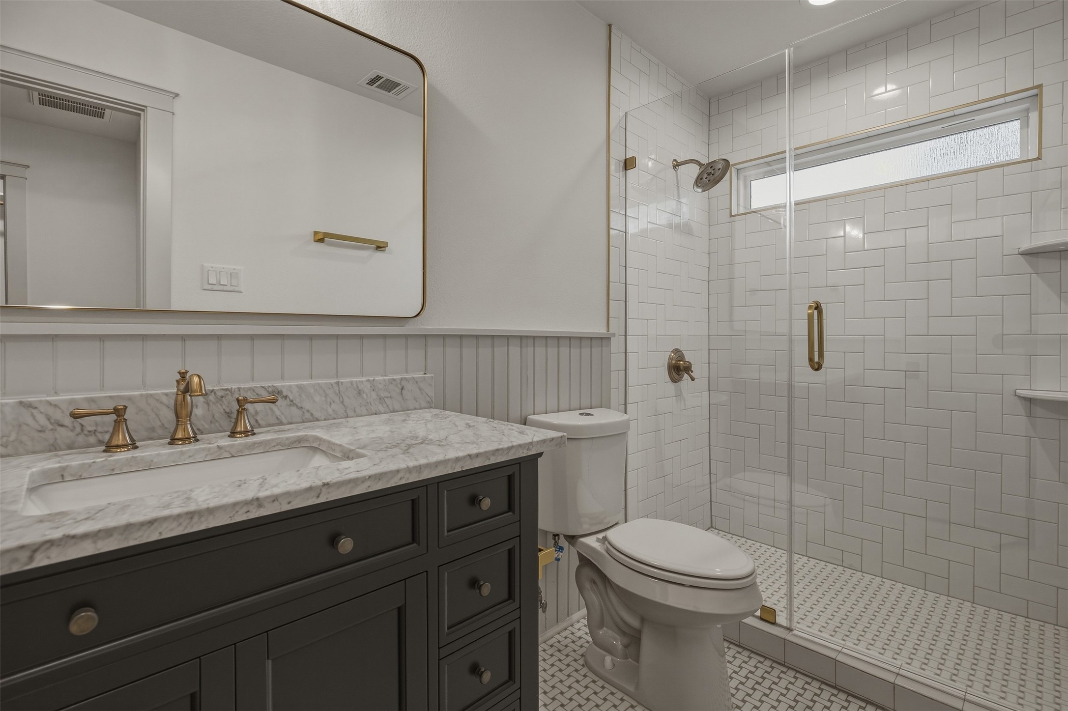 1535 Rutland Street Houston, TX 77008 - Photo 42 of 50 a bathroom with a granite countertop sink toilet and shower
