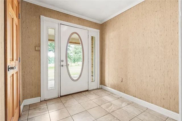 a view of a livingroom with wooden floor and a window