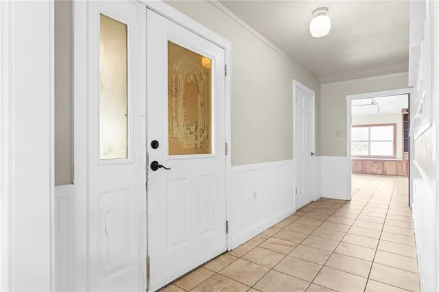a view of an entryway with wooden floor