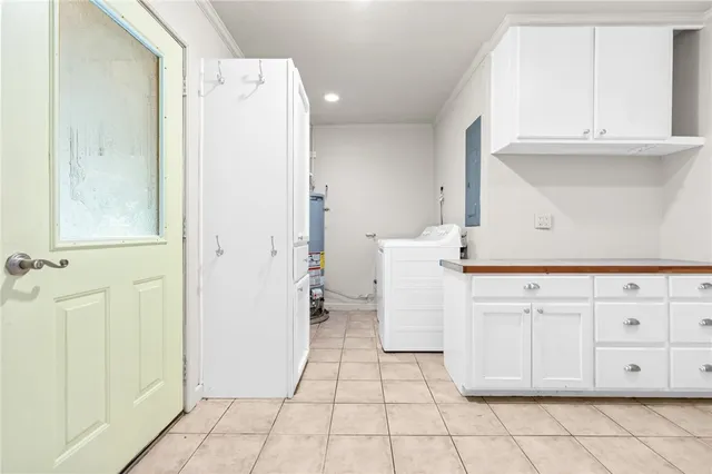 a view of a kitchen with white cabinets