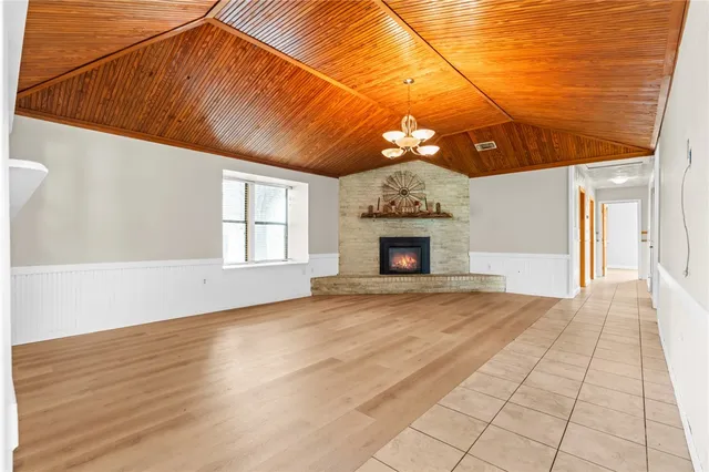 a view of an empty room with a fireplace