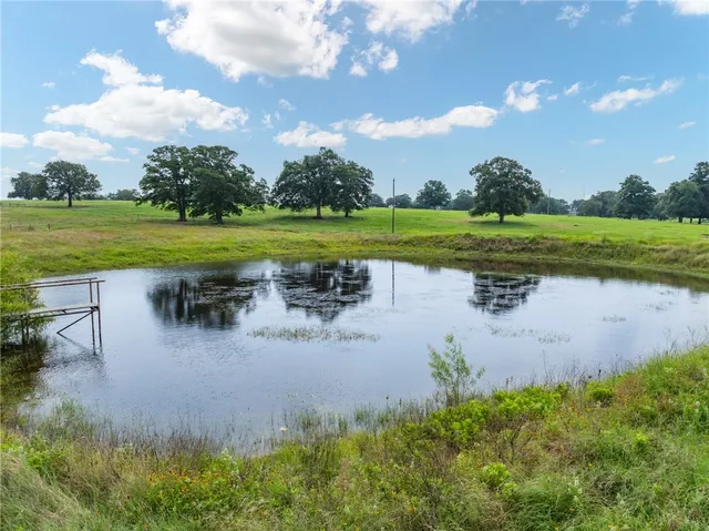 a view of a lake with a yard