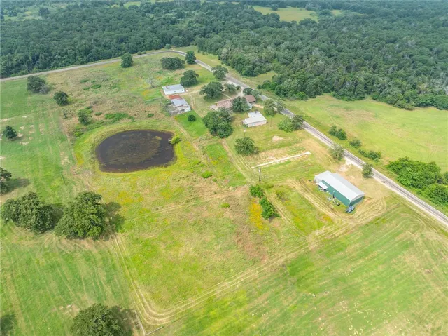 a view of a garden with a house