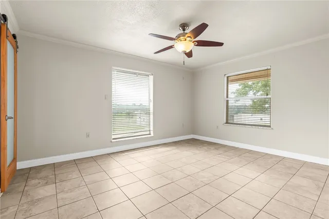 a view of an empty room with a window