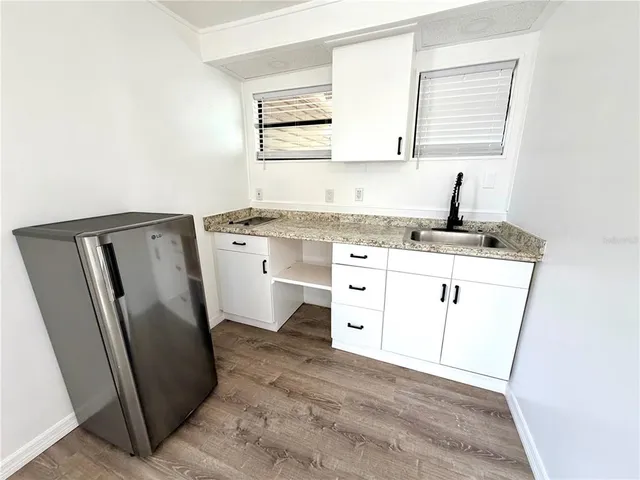 a utility room with a sink a washer and dryer