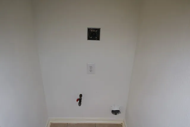 a view of bath room with a window