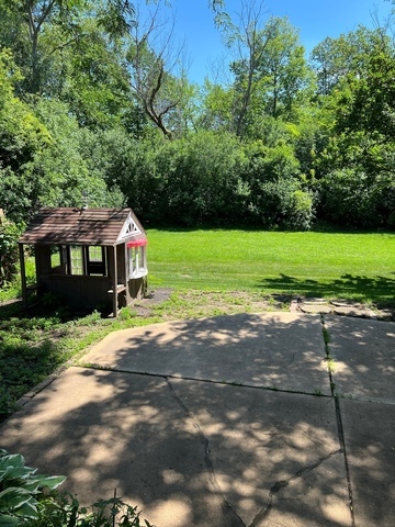 249 Shadow Bend Drive, Unit 249 Wheeling, IL 60090 - Photo 17 of 17 a front view of a house with a yard