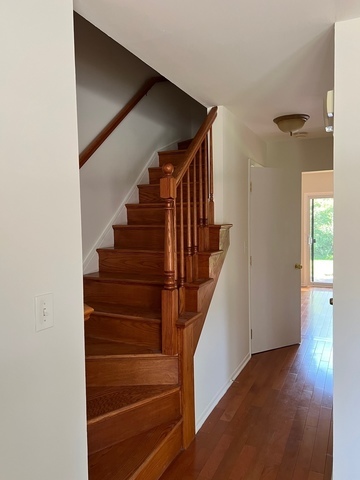 249 Shadow Bend Drive, Unit 249 Wheeling, IL 60090 - Photo 2 of 17 a view of entryway and hall with wooden floor