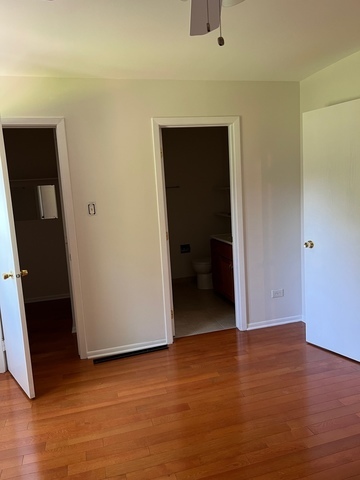 249 Shadow Bend Drive, Unit 249 Wheeling, IL 60090 - Photo 10 of 17 a view of a room with wooden floor and closet
