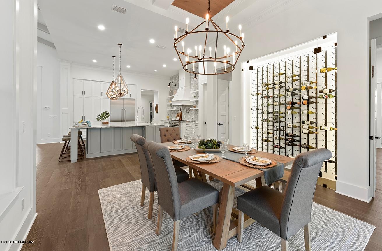 1213 Neck Road Ponte Vedra Beach, FL 32082 - Photo 15 of 48 O. Lighted Wine Rack behind Frameless Gl