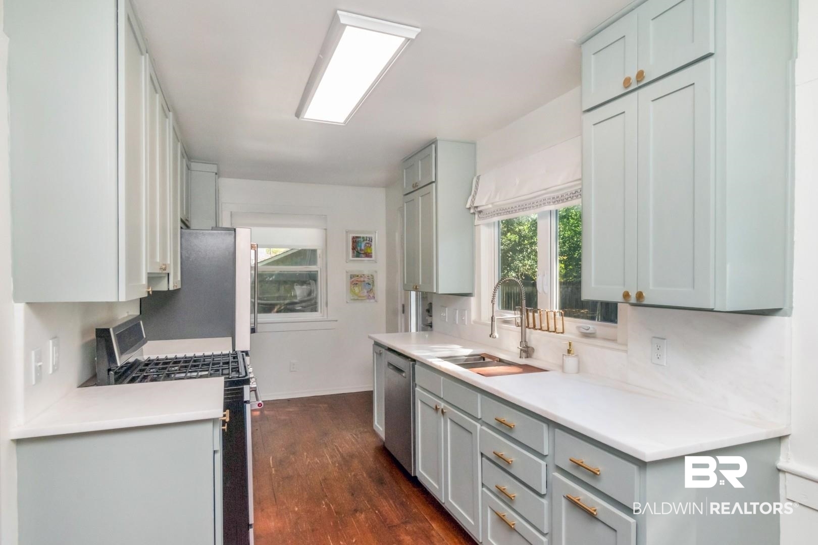 18 Princess Anne Road Mobile, AL 36608 - Photo 11 of 41 Kitchen featuring appliances with stainless steel finishes and dark wood finished floors