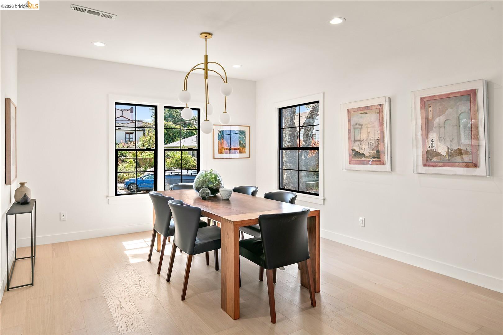 1668 Arch Street Berkeley, CA 94709 - Photo 16 of 78 Light wood-finish flooring, recessed lighting, and a contemporary chandelier