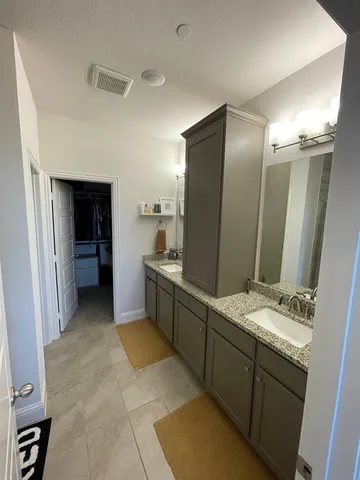 a bathroom with a glass shower door