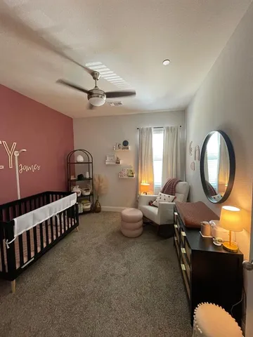 a view of a livingroom with furniture and staircase