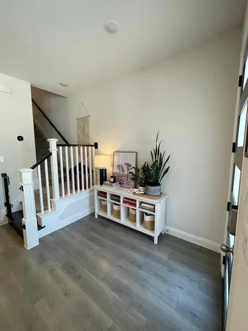 a bathroom with a granite countertop sink and white cabinets