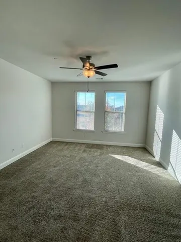 a view of an empty room with a chandelier
