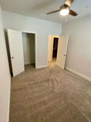 a bathroom with a double vanity sink toilet mirror and bathtub
