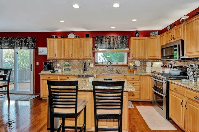 a kitchen with a sink cabinets and window