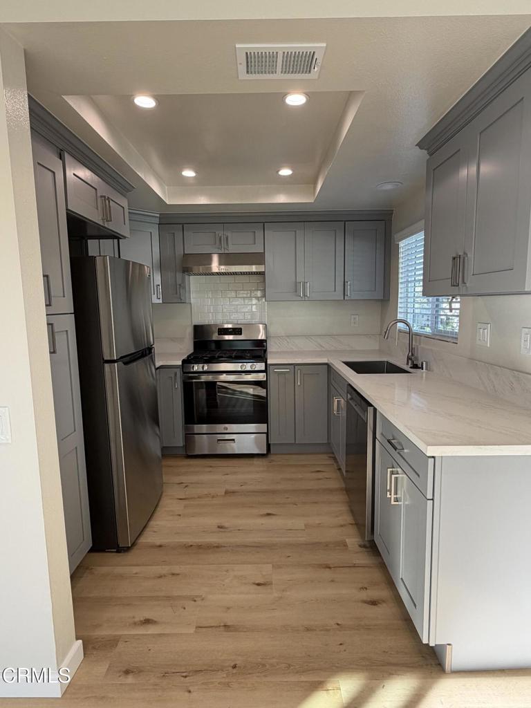 868 Fairview Avenue, Unit A Arcadia, CA 91007 - Photo 13 of 15 a kitchen with stainless steel appliances granite countertop a refrigerator a stove a sink and a microwave