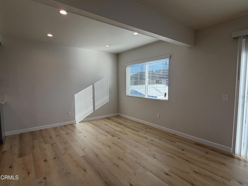 868 Fairview Avenue, Unit A Arcadia, CA 91007 - Photo 4 of 15 an empty room with wooden floor and windows