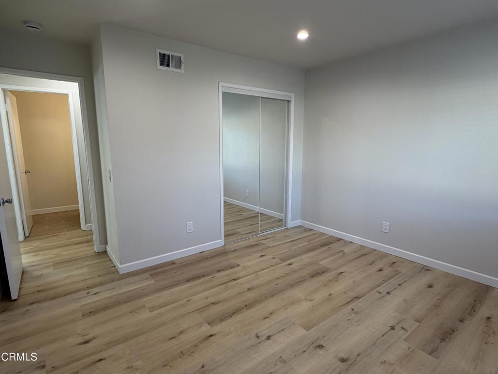 868 Fairview Avenue, Unit A Arcadia, CA 91007 - Photo 7 of 15 an empty room with wooden floor and entrance