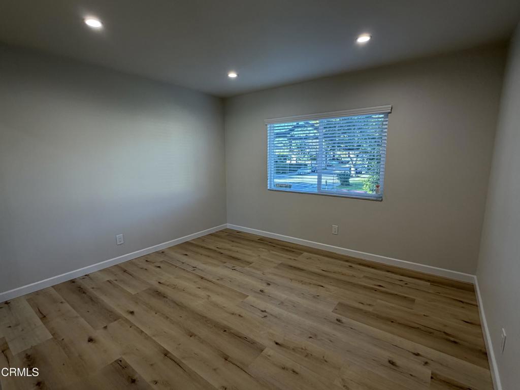 868 Fairview Avenue, Unit A Arcadia, CA 91007 - Photo 8 of 15 an empty room with wooden floor and windows