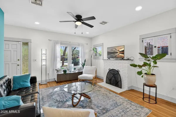 a view of a hallway with furniture and front door