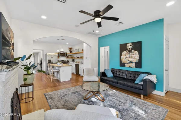 a living room with furniture and a fireplace