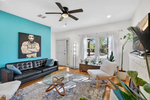 a living room with furniture and a fireplace