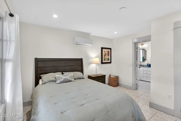 a kitchen with stainless steel appliances granite countertop a refrigerator a stove and a wooden floors