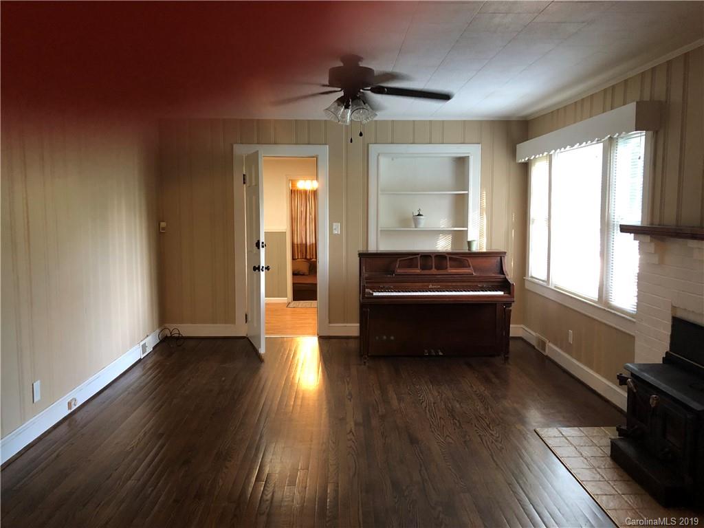 726 Valleydale Road Charlotte, NC 28214 - Photo 2 of 32 a view of a livingroom with wooden floor and a window