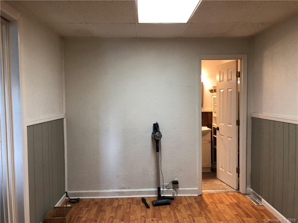 726 Valleydale Road Charlotte, NC 28214 - Photo 13 of 32 an empty room with a door
