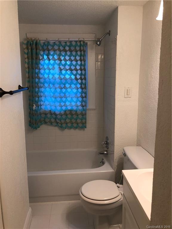 726 Valleydale Road Charlotte, NC 28214 - Photo 20 of 32 a bathroom with a toilet and a shower