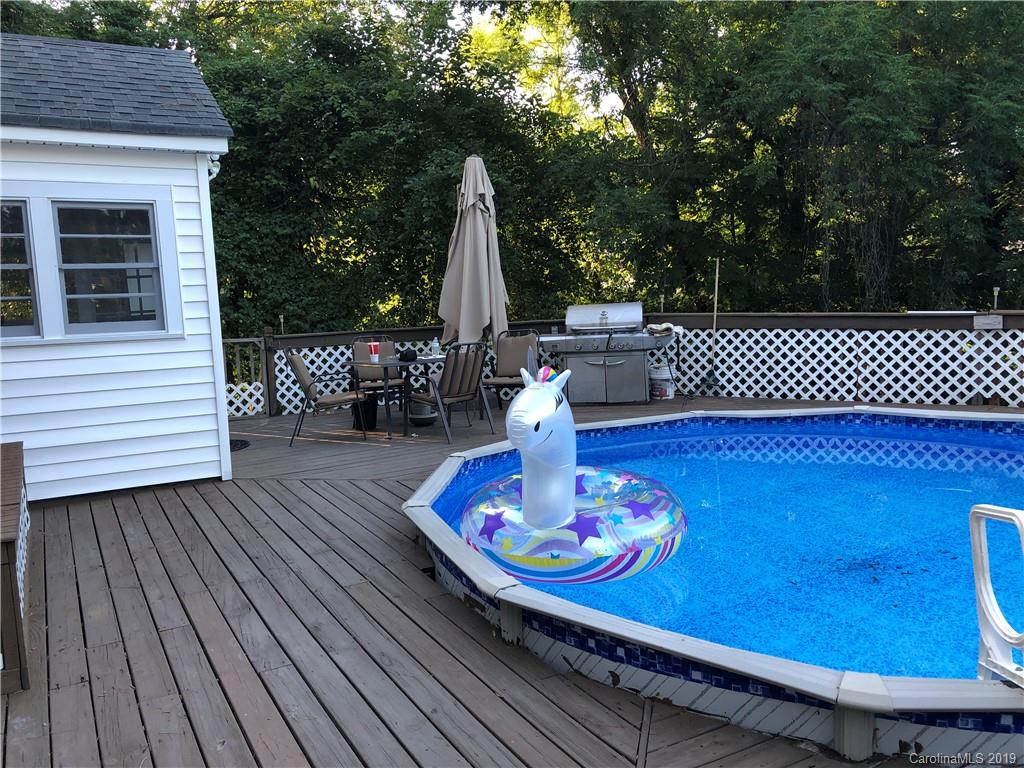 726 Valleydale Road Charlotte, NC 28214 - Photo 24 of 32 a wooden deck with sunset view