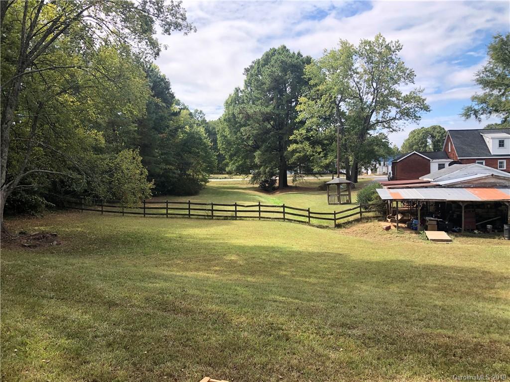 726 Valleydale Road Charlotte, NC 28214 - Photo 29 of 32 a view of a swimming pool with an outdoor seating and a yard