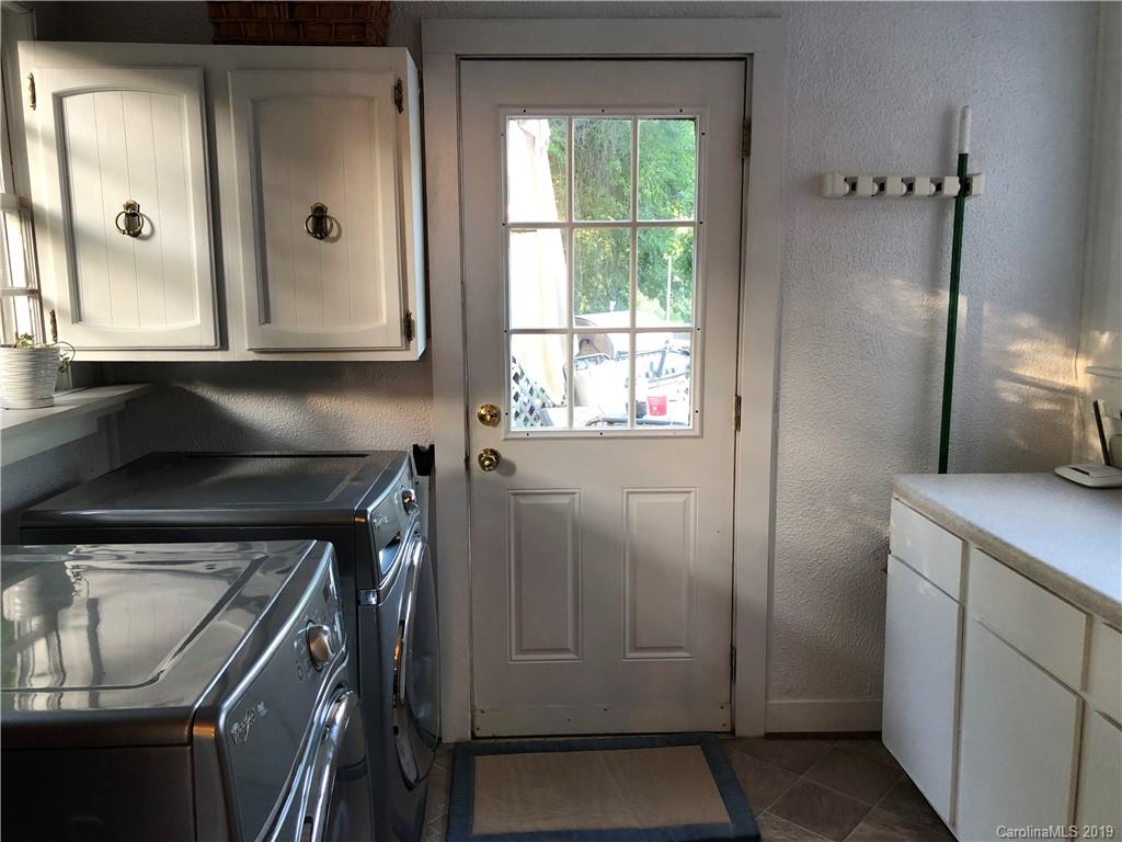 726 Valleydale Road Charlotte, NC 28214 - Photo 8 of 32 a kitchen with a refrigerator and window