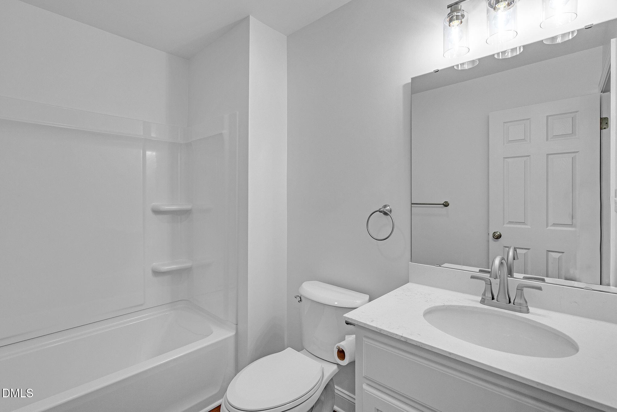 1219 Queen Anne Road Northwest Wilson, NC 27896 - Photo 19 of 26 a bathroom with a sink toilet and shower