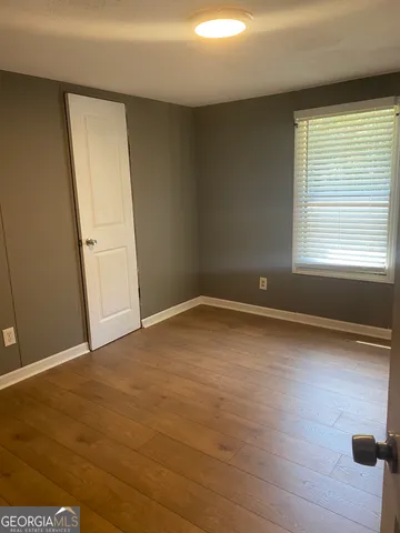 a bathroom with a shower and a toilet