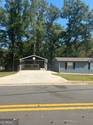 a view of a house with a swimming pool