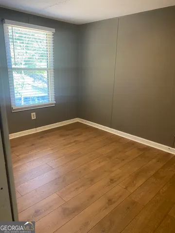a balcony with wooden floor